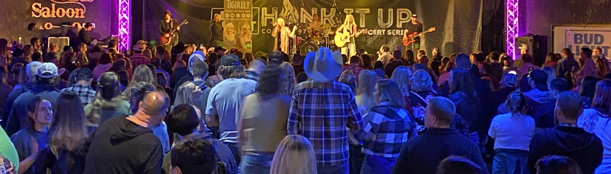 country concert with fans wearing cowboy hats Billings