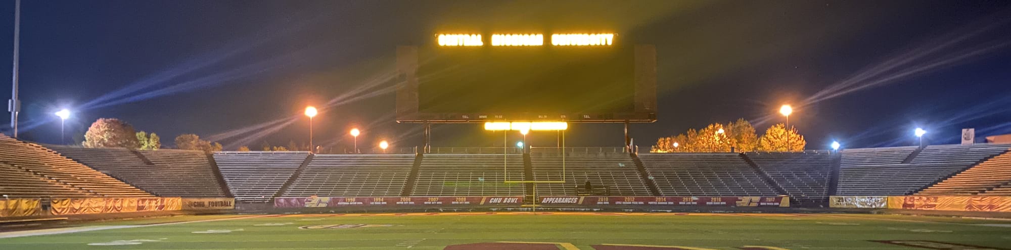 empty football stadium at night under the lights Billings